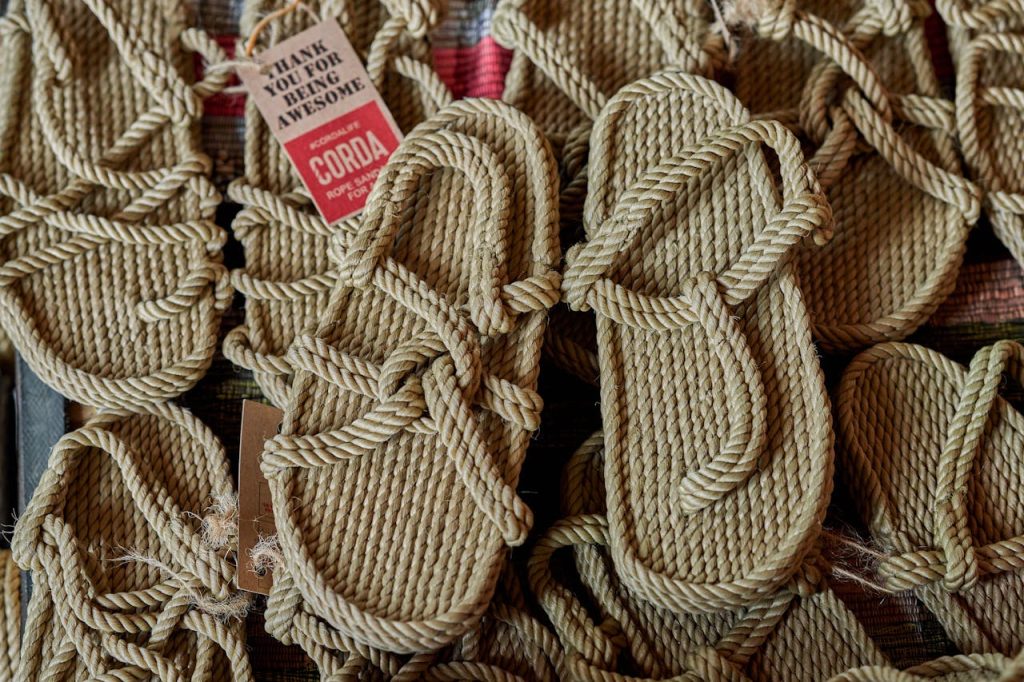 Detailed shot of handcrafted rope sandals, eco-friendly footwear option.